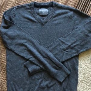 Grey V neck sweater.